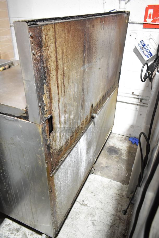 Bakers Pride commercial gas range, 6 burners, flat top griddle, cheese melter, 2 ovens, backsplash, used condition.