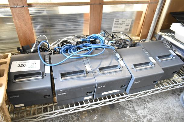 Five Epson receipt printers, including Model M244A, with assorted cables, in used condition, labeled as lot 226 for auction.