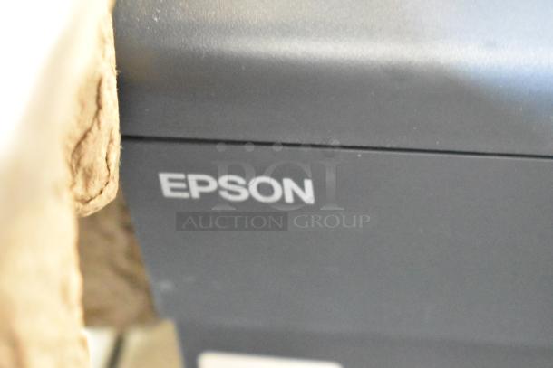 5 Epson receipt printers including Model M244A, shown with Epson branding visible. Auction lot, good condition.
