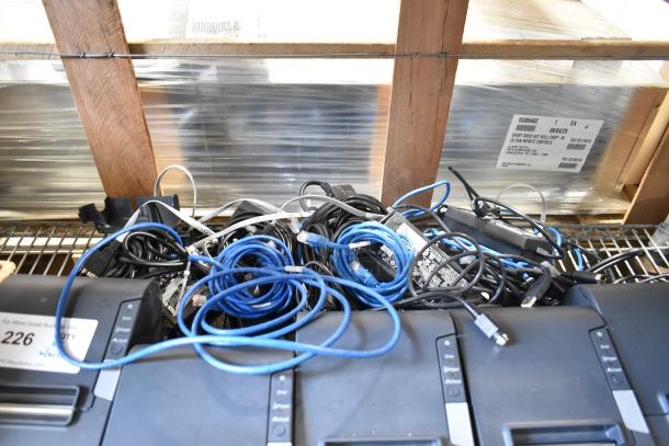 Five Epson receipt printers, including Model M244A, with assorted cables. Moderate wear, ideal for business use.