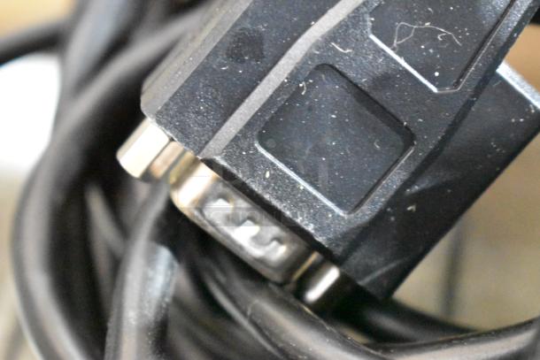Close-up of a black cable connector for Epson Receipt Printers, including Model M244A. Appears slightly used.