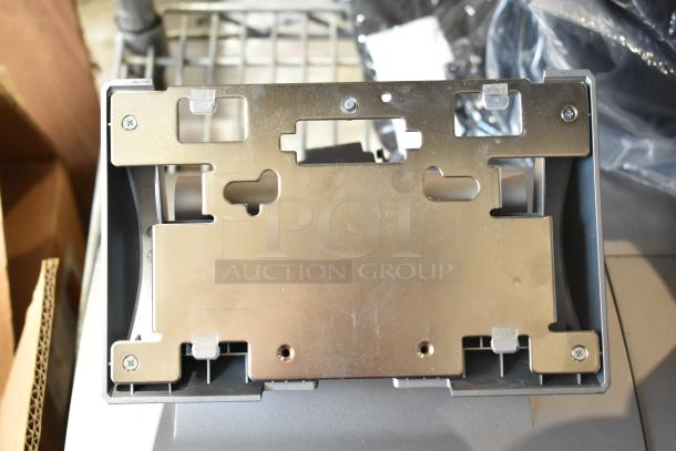 5 Micros Oracle POS docking stations in good condition, metal mounting brackets visible, ideal for business use.