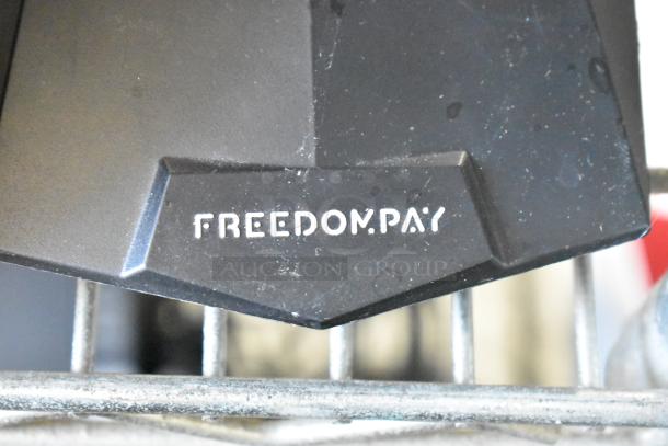 5 Micros Oracle POS Docking Stations, featuring FreedomPay branding, visible wear, ideal for retail setups.