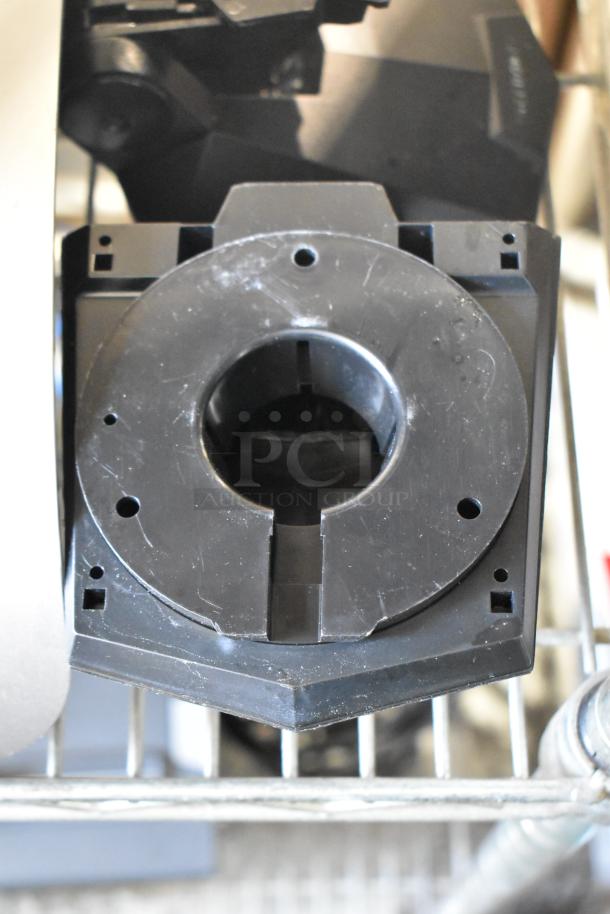 5 Micros Oracle POS docking stations, black, showing signs of wear. Auction includes five units for combined bidding.