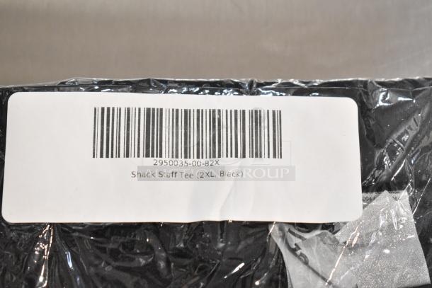 9 new scratch and dent items, including black unisex Shack Staff Tee, size 2XL, with barcode label.