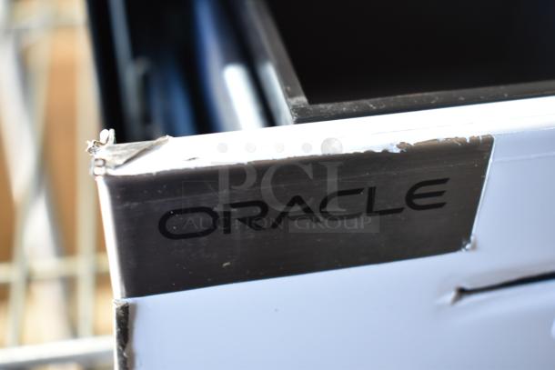 Oracle cash drawer with visible wear, part of a lot including Epson M244A printers and Lenovo 11UG.