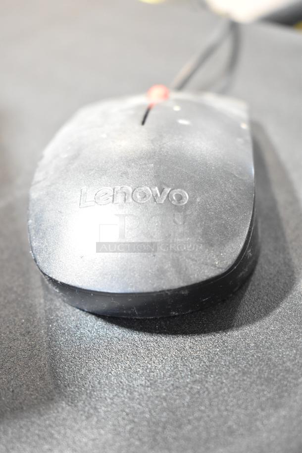 Lenovo wired mouse, black, with visible Lenovo logo, slight dust, good condition. Part of a 9-item tech auction lot.