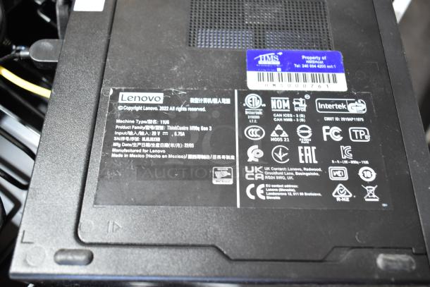 Close-up of Lenovo ThinkCentre M90q Gen 3 label, showing model type 11UG, power specifications, and certification marks.