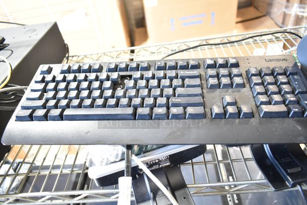 Lot of 9 items including Oracle cash drawer, Epson M244A receipt printers, Lenovo 11UG keyboard. Dusty condition.