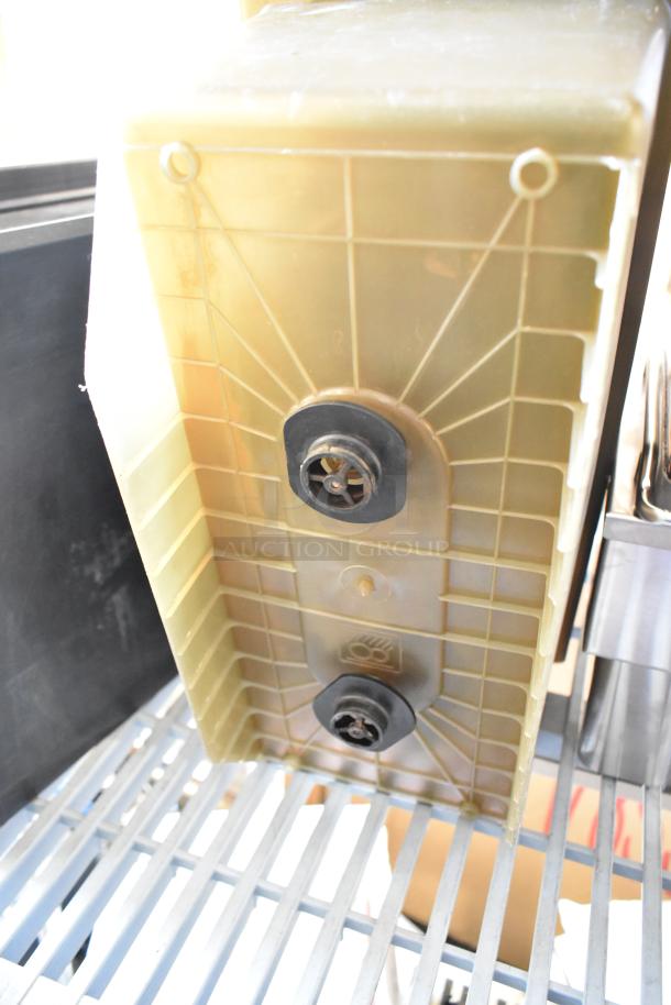 Plastic storage bin with visible bottom drain fittings, in good condition. Bidding doubles your offer for two items.