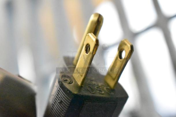 Close-up of a three-prong power plug, part of a Bunn SH-S Server Satellite Server with 120 volts, 1 phase.