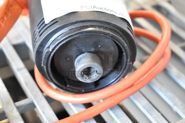 Immersion blender motor, no blade. 115 volts, 1 phase, orange cord. "PCIAuctions.com" visible on label.