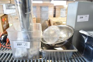 Lot of various kitchen items including a metal bowl, drop-in bins, poly bin. Tags show lot numbers 237 and 239.