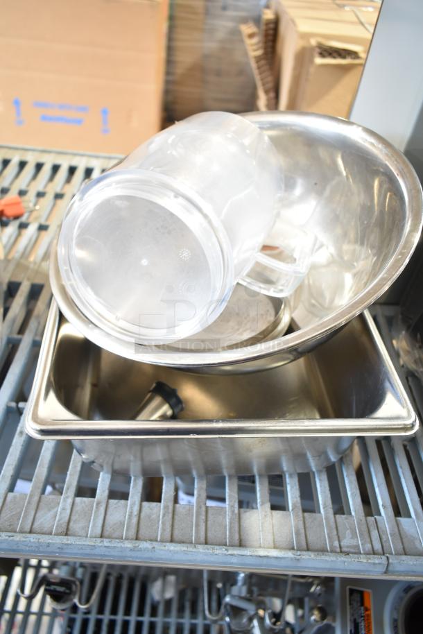 Lot of various items including a metal bowl, clear poly bins, and drop-in bins, all in used condition.