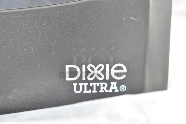 Dixie Ultra countertop napkin dispenser, black, branded logo visible, in good condition. Offers functionality and modern design.