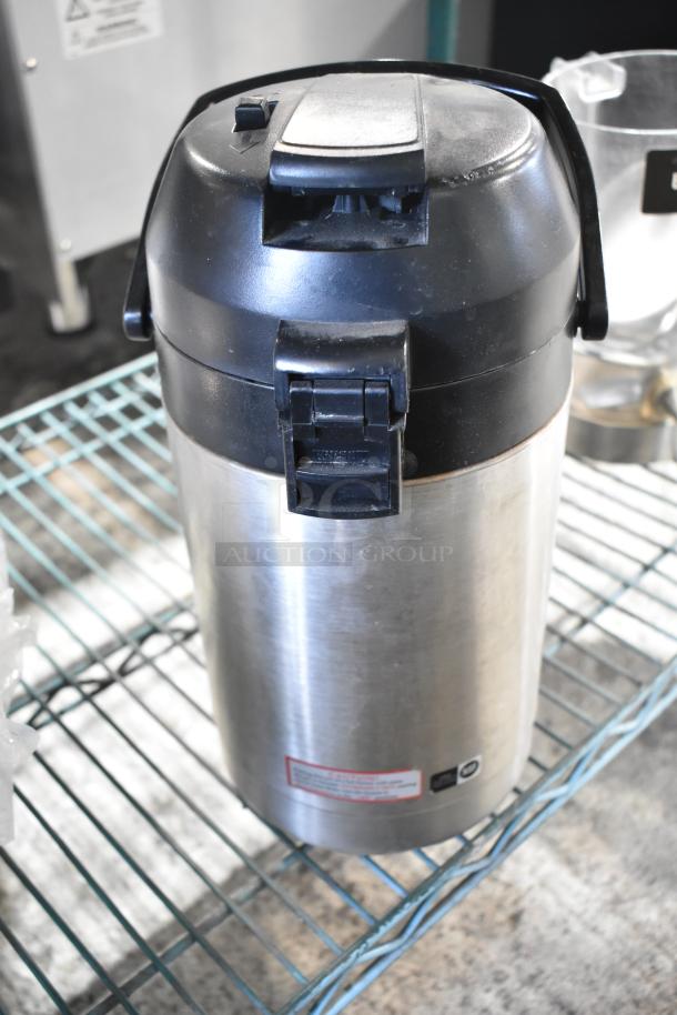 Auction lot includes a stainless steel beverage dispenser, visible latch and handle; part of a mixed item collection.