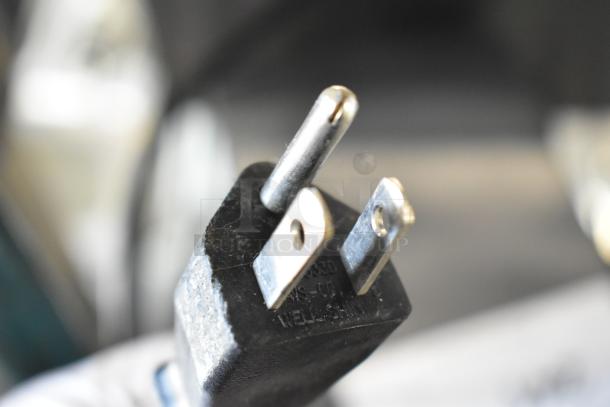 Close-up of a three-pronged plug for the ABC302-11W Power Conditioner, 120V, 1 Phase, showing engraved markings.