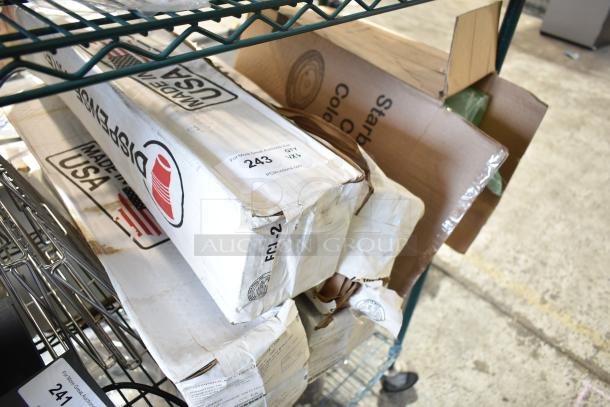 6 various cup dispensers in original packaging with visible wear. Boxes marked "Made in USA" and labeled "243 QTY V1X."