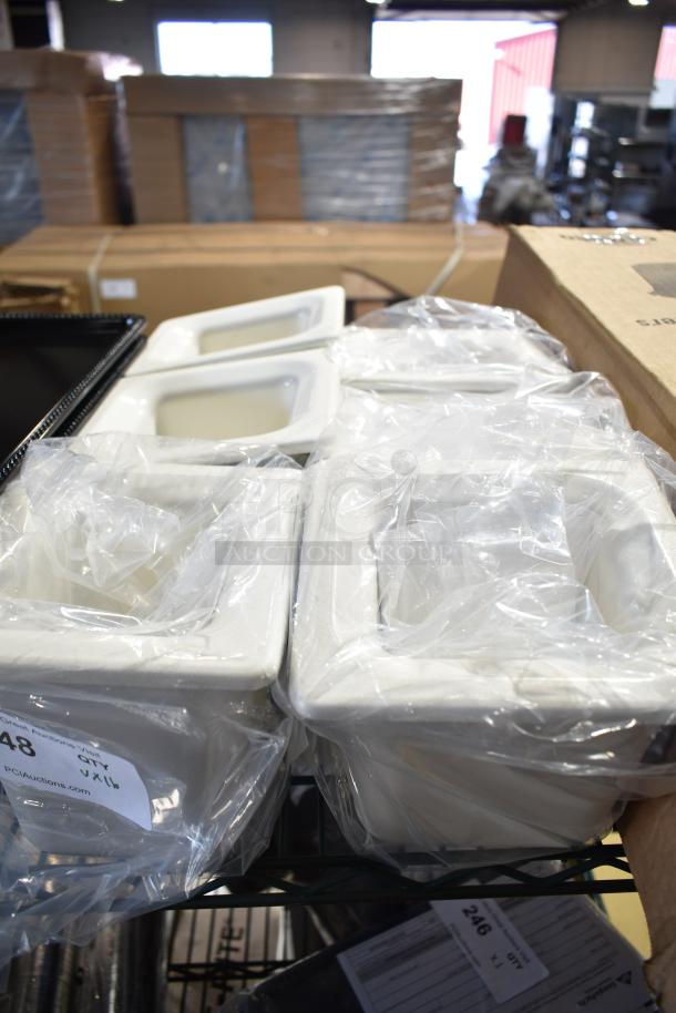16 items including black poly trays, poly insulated drop-in bins, and Cambro RFS4148 4qt containers, wrapped and new.