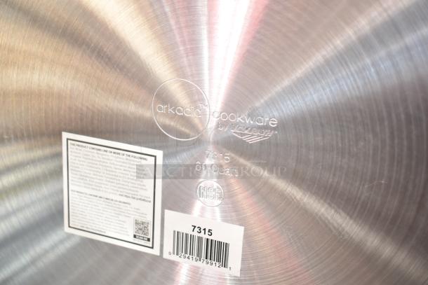 BRAND NEW SCRATCH AND DENT Vollrath 7315 Arkadia 60 Qt. Aluminum Stock Pot with NSF label; brand markings visible.