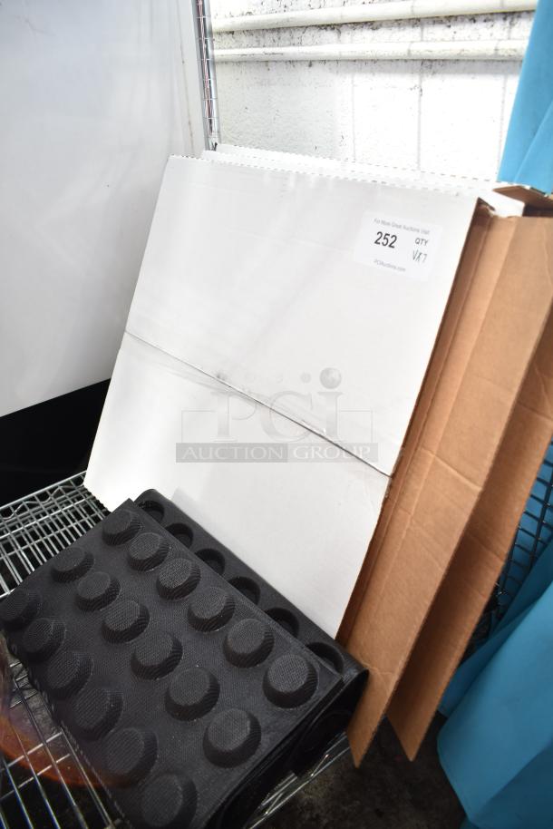 New auction items including Norton Screen-Bak Durite Q421 sheets, baking pan liners, and cardboard. Box labeled "252 QTY VKT".