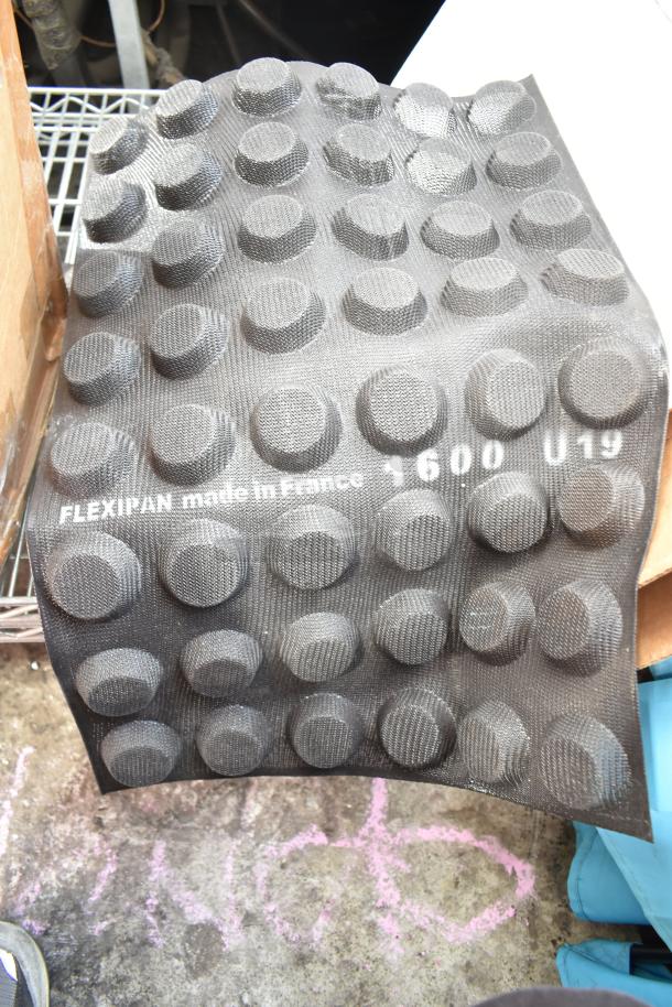 Flexible baking mold, Flexipan, black, textured, made in France, labeled "1600 U19," new condition.
