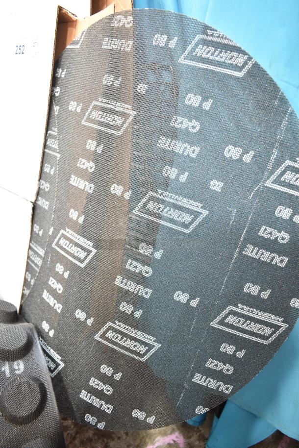 Seven brand new Norton Screen-Bak Durite Q421 sheets, 9x11, P80 grit shown.