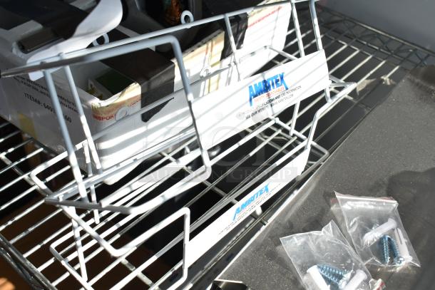 Six brand new scratch and dent items, including metal pieces and a white rack with labeled "Ambitex" box, plus bagged screws.
