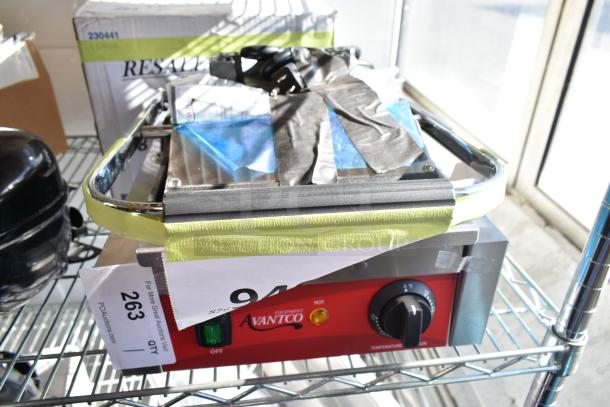 Brand new Avantco 177PG100S Panini grill, smooth plates, 8.5"x8.5" cooking surface, 120V, scratch and dent, red control panel.