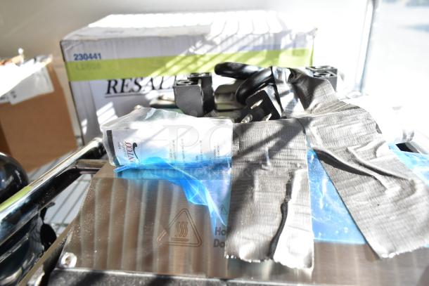 Brand new Avantco 177PG100S commercial panini grill, smooth plates, 8.5"x8.5" surface, 120V, scratch and dent condition.