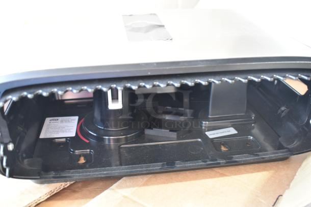 BRAND NEW Tork 712465500 stainless steel double jumbo roll toilet paper dispenser, image shows interior mechanism.