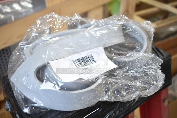 Box of brand new "scratch and dent" items, including Berkel blade. Includes label with product details and barcode.