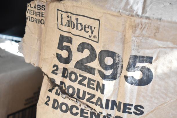 Libbey 5295 Irish Glass Coffee Mug packaging, marked "2 Dozen," shows brand and model number. Box is slightly damaged.