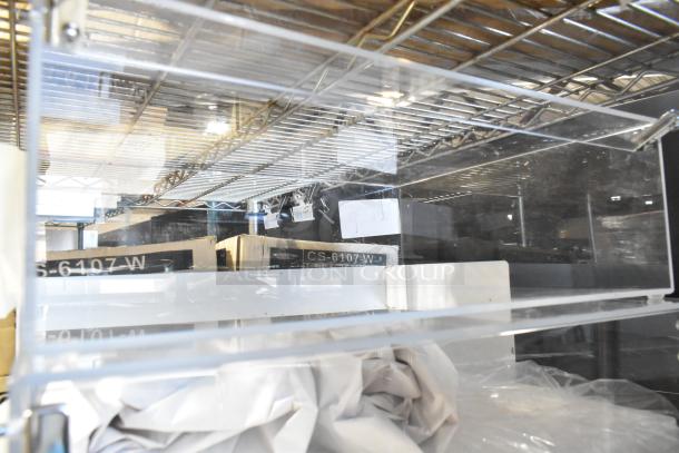 Brand new scratch and dent countertop dry display case merchandiser, clear acrylic with minor cosmetic imperfections visible.