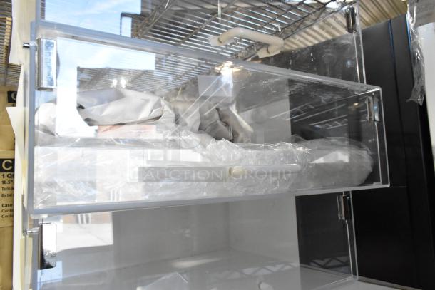 Brand new scratch and dent countertop dry display case merchandiser, clear acrylic, metal hinges, protective wrapping included.