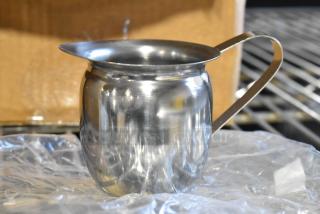 Brand new BCR-5 Bell Creamer, stainless steel, minor scratches, features a spout and handle, ideal for serving cream.