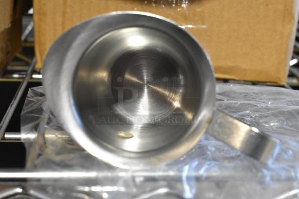 2 brand new BCR-5 Bell Creamers, stainless steel, slight scratch and dent; shown in packaging on metal rack.