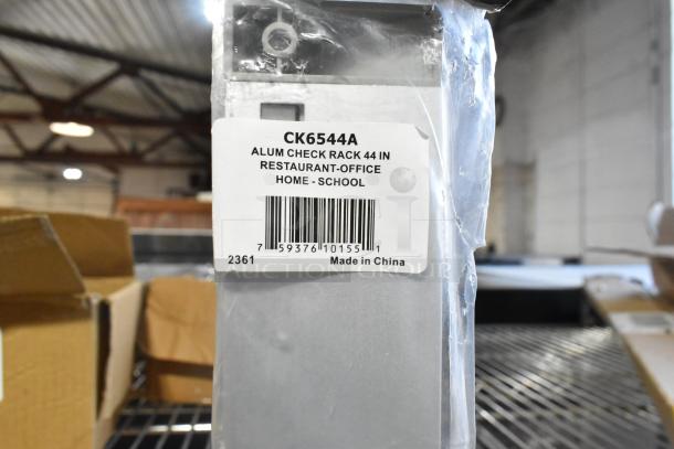 San Jamar CK6544A aluminum ticket holder, 44"x2", wall-mounted, new condition, scratch and dent, made in China.