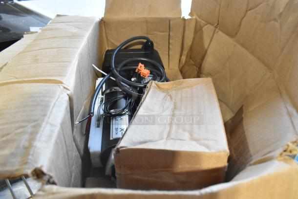 Brand new scratch and dent 2022 CAHB-22-F5E-1500379-BBA0PT-132 actuator in original box with visible wiring and components.