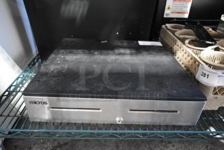 Micros cash drawer, black and silver, visible wear, key lock on front, suitable for retail use, auction tag 281.