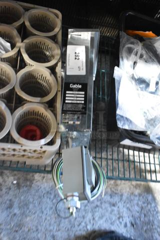 2022 Paige 980054C LED power supply box, includes wiring. Gable label and inventory tag indicating "282." Appears in good condition.