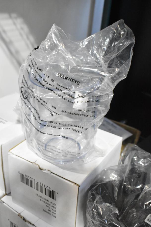 Packaged jam jars and reusable craft cups in plastic wrap on boxed stacks, with visible barcode labels; scratch and dent condition.