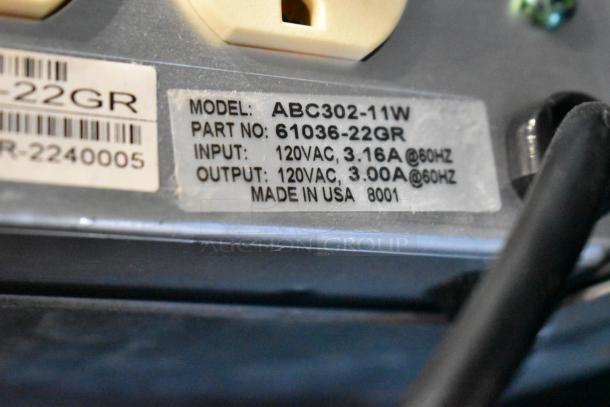 Label of a power conditioner, Model ABC302-11W, Part 61036-22GR, 120VAC input/output, Made in USA.