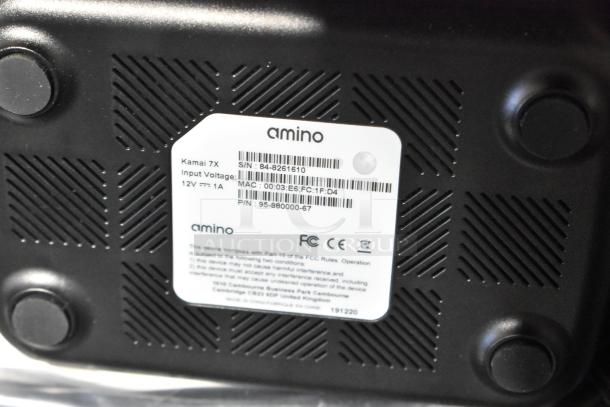 Amino Kamai 7X label, showing serial and MAC number. Device specs: Input Voltage 12V, 1A. Part of a 9-item auction set.
