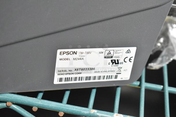 Epson TM-T88V M244A receipt printer label, showing model, serial number X6T6033386, and certification marks.