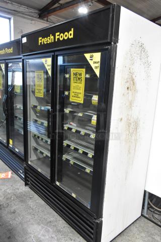 True GDM-49 Commercial 2 Door Reach-In Cooler, visible wear, 115V, 1 Phase. "Fresh Food" signage, glass doors.