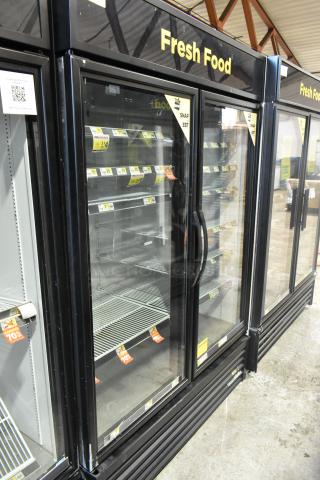 2019 True GDM-49-HC commercial cooler, 2-door, glass front, black exterior, measuring shelves, 115 volts, 1 phase.