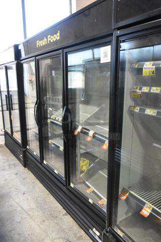 2022 True GDM-72-HC commercial 3-door reach-in cooler, featuring glass doors, fresh food signage, and shelving. 115V, 1 phase.