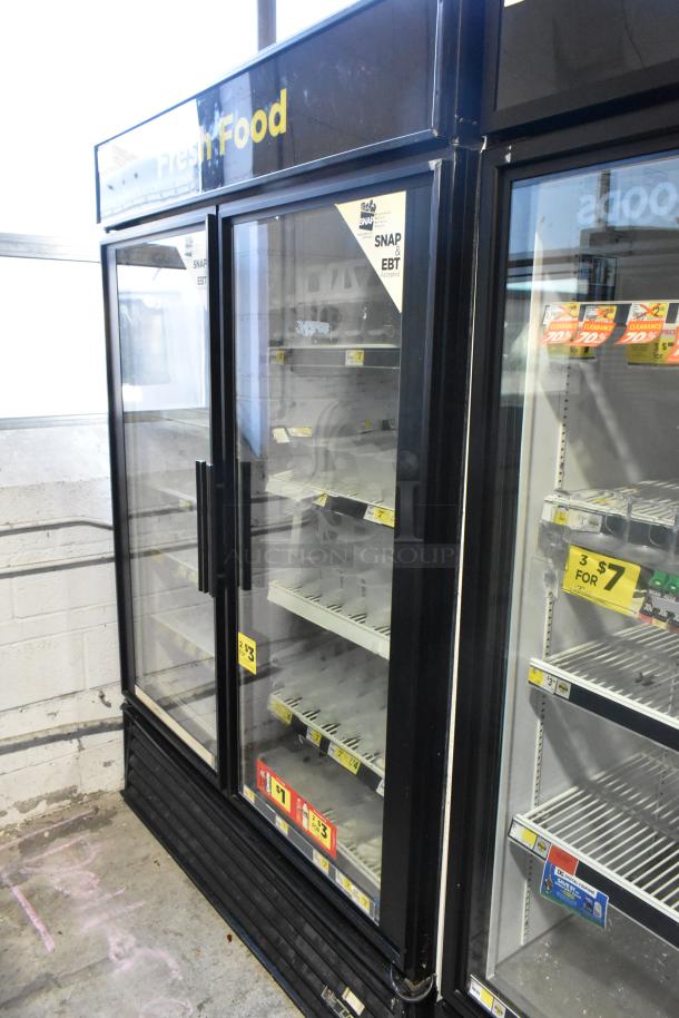 2019 True GDM-49 commercial two-door reach-in cooler, 115 volts, 1 phase, good condition, visible price tags.