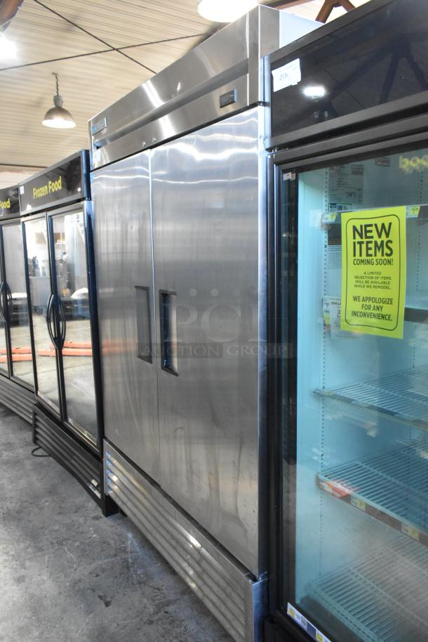 2019 True T-49F-HC commercial 2-door reach-in freezer, stainless steel, on casters. Model and brand labels visible.